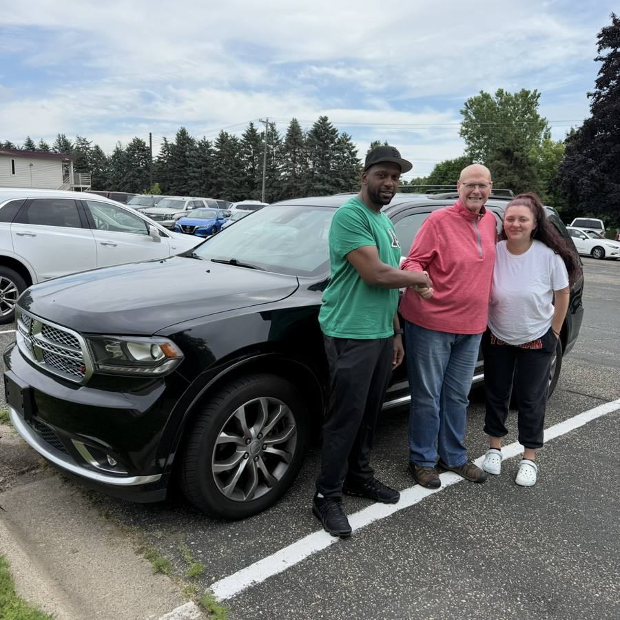 Front Line Auto customers with their Dodge Durango