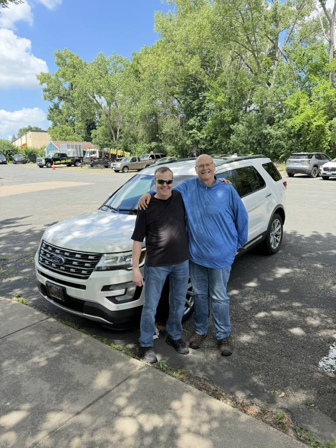 Front Line Auto customers with their Ford Explorer