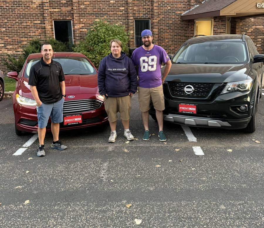 Front Line Auto customers with their new vehicles